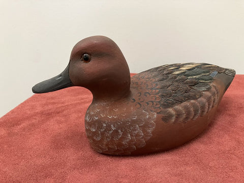 Carved wooden ducks, signed by artist