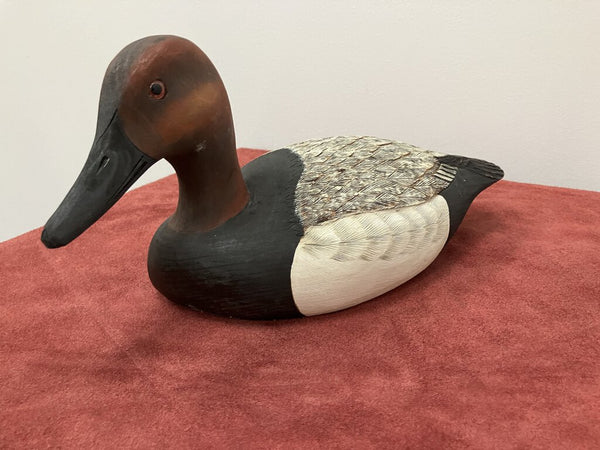 Carved wooden ducks, signed by artist