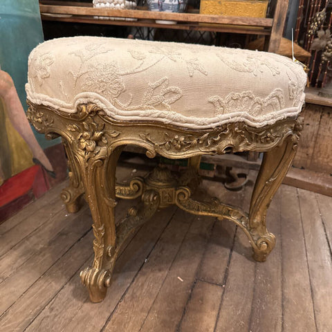 Upholstered gold gilt footstool