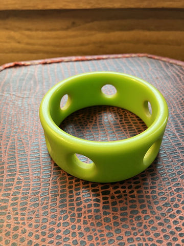Vintage lime green Bakelite bracelet with "portholes"
