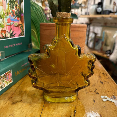 Small amber glass maple leaf bottle
