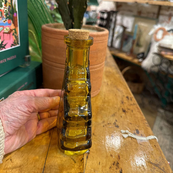 Small amber glass maple leaf bottle
