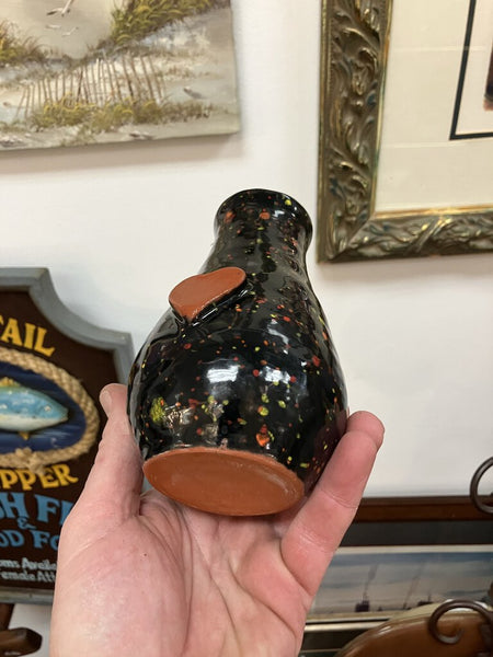 Signed black speckled ceramic flower planter with heart