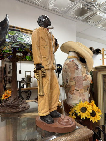Vintage carved wood jazz singer, maybe Louis Armstrong.