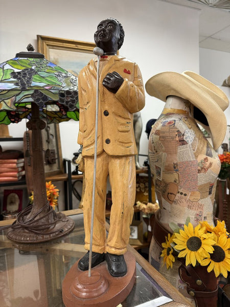 Vintage carved wood jazz singer, maybe Louis Armstrong.