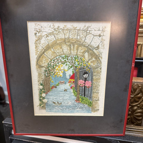 Vintage embroidered and painted 75scene, path next to river in city