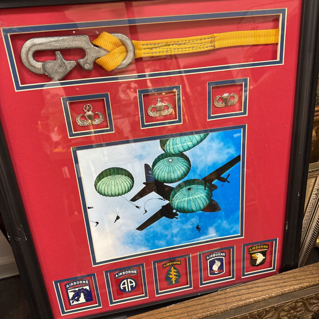 Paratrooper display with insignias and static line cord