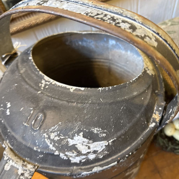 Large black chippy watering can