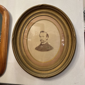 PORTRAIT IN ANTIQUE OVAL FRAME 23" x 21". IN STORE PICKUP