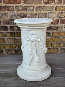 Plaster bow detail pedestal