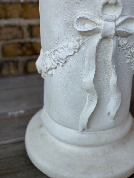 Plaster bow detail pedestal