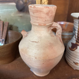 Sand colored primitive pottery jug