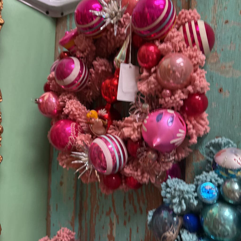 Pink wreath with angel and red topper