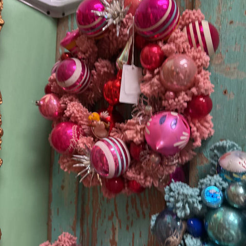 Pink wreath with angel and red topper