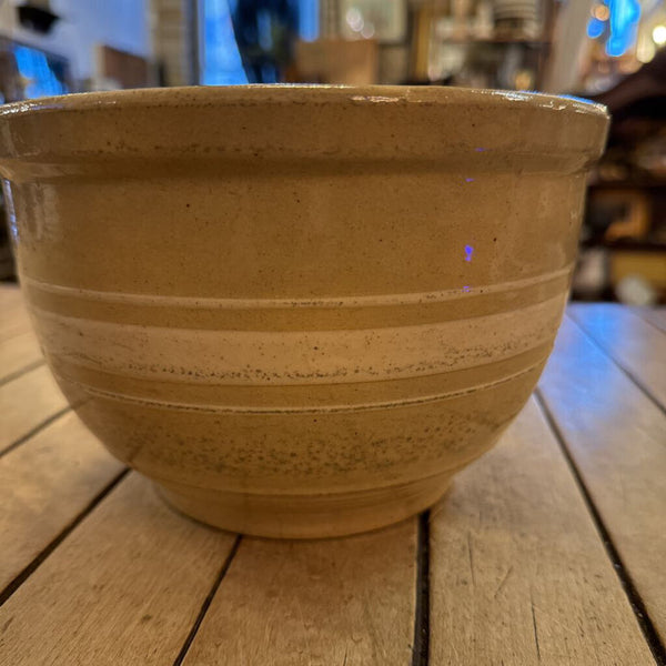 Yellow Watt ware eve-n-ware bowl with stripes. 5" H 8" Diameter at top of bowl