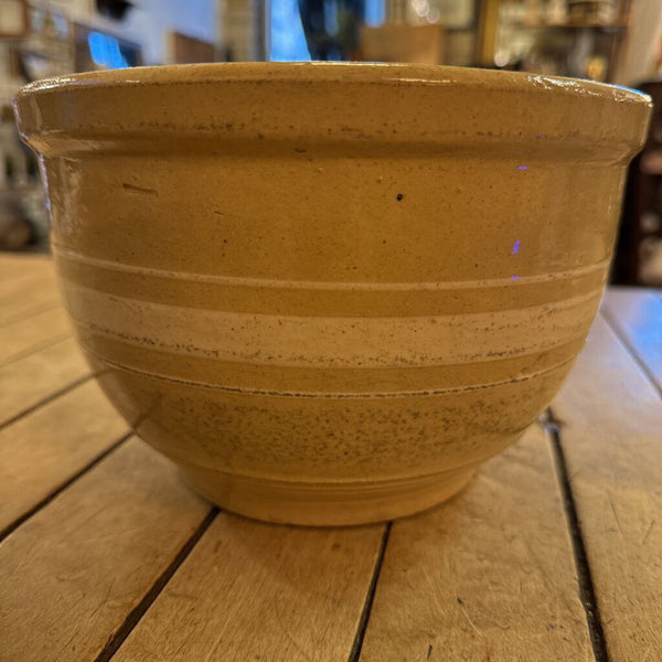 Yellow Watt ware eve-n-ware bowl with stripes. 5" H 8" Diameter at top of bowl