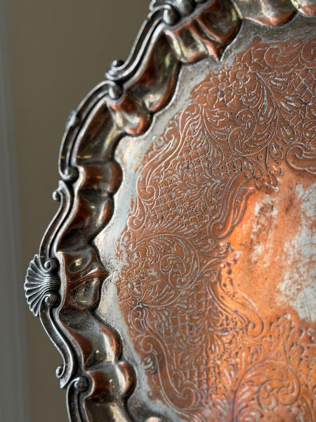 0955 English Silverplate over copper footed round tray