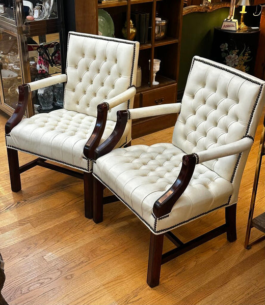 PAIR OF JASPER SEATING ANILINE-DYED WHITE LEATHER AND WOOD TUFTED ARMCHAIRS WITH BRASS NAILHEAD TRIM, AS FOUND. 35"H x 27"D x 24"W. IN STORE PICKUP.