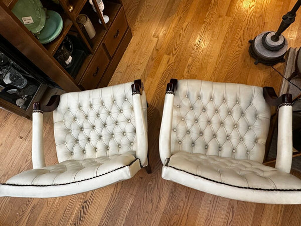 PAIR OF JASPER SEATING ANILINE-DYED WHITE LEATHER AND WOOD TUFTED ARMCHAIRS WITH BRASS NAILHEAD TRIM, AS FOUND. 35"H x 27"D x 24"W. IN STORE PICKUP.
