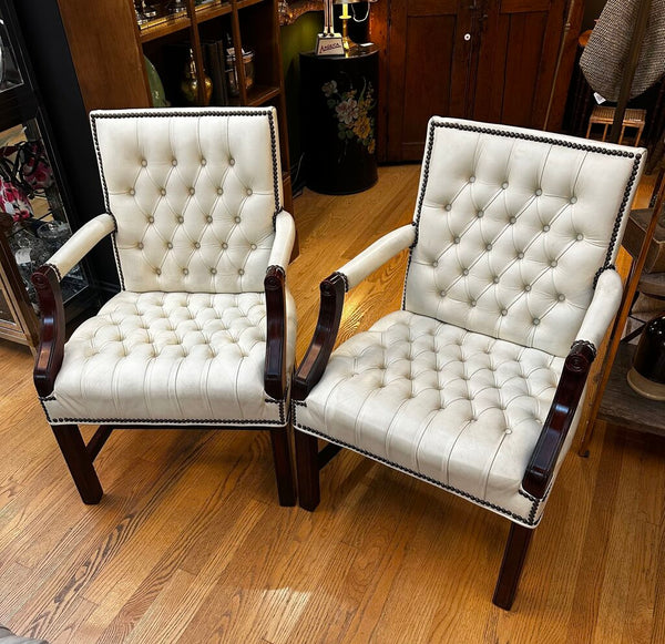 PAIR OF JASPER SEATING ANILINE-DYED WHITE LEATHER AND WOOD TUFTED ARMCHAIRS WITH BRASS NAILHEAD TRIM, AS FOUND. 35"H x 27"D x 24"W. IN STORE PICKUP.