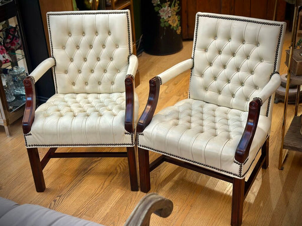 PAIR OF JASPER SEATING ANILINE-DYED WHITE LEATHER AND WOOD TUFTED ARMCHAIRS WITH BRASS NAILHEAD TRIM, AS FOUND. 35"H x 27"D x 24"W. IN STORE PICKUP.