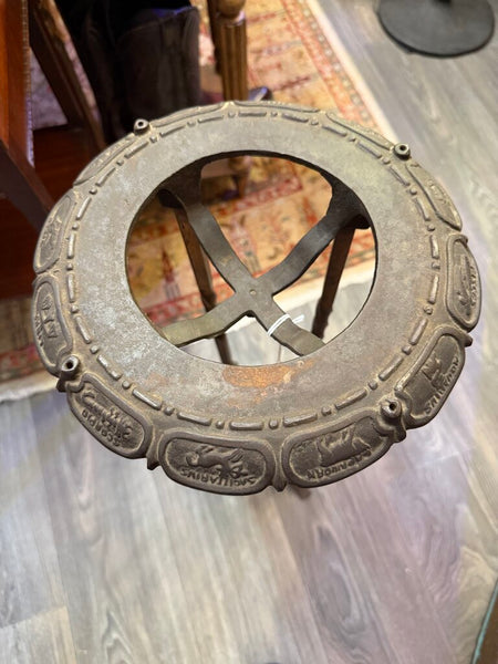 Victorian cast iron stand with zodiac motif