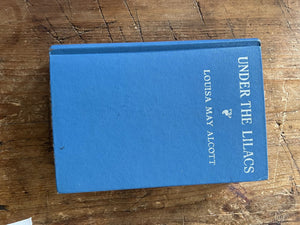 Blue covered book, Under the Lilacs, by Louisa May Alcott