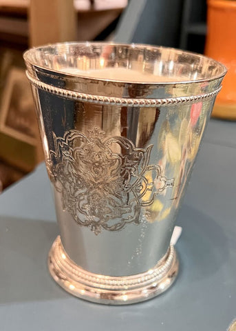 Candle in engraved silver cup