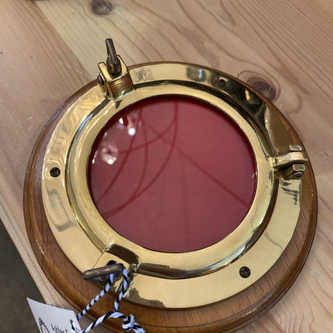 Brass and wood port hole frame